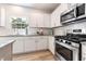 Bright kitchen with stainless steel appliances and granite countertops at 21 Green Links Dr, Cameron, NC 28326