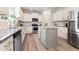 Well-lit kitchen with stainless steel appliances, granite countertops, and ample cabinet space at 21 Green Links Dr, Cameron, NC 28326