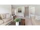 Relaxing living room with comfortable seating, a view of the staircase, and natural light at 21 Green Links Dr, Cameron, NC 28326
