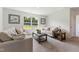Cozy living room with comfortable seating, large window, and decorative accents at 21 Green Links Dr, Cameron, NC 28326