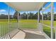 Relaxing screened-in porch with views of the backyard and surrounding greenery at 21 Green Links Dr, Cameron, NC 28326