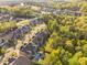 Aerial shot showcasing a residential area with well-maintained homes, tree-lined streets, and lush greenery at 212 Blue Granite Dr, Holly Springs, NC 27540