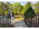View of the home's backyard featuring an in-ground pool, slide, and a patio area at 212 Blue Granite Dr, Holly Springs, NC 27540