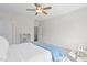 Bedroom with neutral walls, carpet and ceiling fan with view through doorway at 212 Blue Granite Dr, Holly Springs, NC 27540