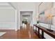 Welcoming foyer with hardwood floors and neutral paint, offering a glimpse into the living spaces at 212 Blue Granite Dr, Holly Springs, NC 27540