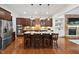 Open kitchen with stainless appliances, granite counters, and bar stool seating at 212 Blue Granite Dr, Holly Springs, NC 27540