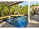 Backyard pool featuring slide, diving board, and lush landscaping, perfect for outdoor enjoyment at 212 Blue Granite Dr, Holly Springs, NC 27540