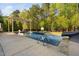 Inviting backyard pool with a pergola and a basketball hoop, surrounded by lush greenery at 212 Blue Granite Dr, Holly Springs, NC 27540
