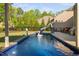 Backyard pool featuring a slide, basketball hoop, and a swan floatie, perfect for summer fun at 212 Blue Granite Dr, Holly Springs, NC 27540
