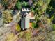 An aerial perspective highlights this home's placement amidst lush greenery and mature trees at 213 Huntington Dr, Chapel Hill, NC 27514