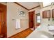 Bathroom featuring double sinks, mirrors, and wood trim at 213 Huntington Dr, Chapel Hill, NC 27514