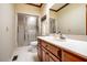 Bathroom featuring a glass-enclosed shower and a wood vanity with a sink at 213 Huntington Dr, Chapel Hill, NC 27514