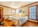 Sunny bedroom with hardwood floors, two twin beds, and a bright, airy feel at 213 Huntington Dr, Chapel Hill, NC 27514