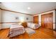 Comfortable bedroom featuring hardwood floors, twin beds, and ample closet space at 213 Huntington Dr, Chapel Hill, NC 27514