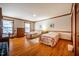 Bright bedroom with hardwood floors, twin beds, and natural light from two windows at 213 Huntington Dr, Chapel Hill, NC 27514