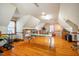 Expansive bonus room with hardwood floors, featuring ample light and flexible layout options at 213 Huntington Dr, Chapel Hill, NC 27514