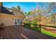 Spacious wooden deck provides a relaxing outdoor living area with views of the beautifully landscaped backyard and mature trees at 213 Huntington Dr, Chapel Hill, NC 27514