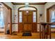 Inviting entryway with a solid wood door, sidelights and complementing wood trim and hardwood floors at 213 Huntington Dr, Chapel Hill, NC 27514