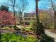 Exterior of a home featuring a landscaped front yard and colorful trees and bushes at 213 Huntington Dr, Chapel Hill, NC 27514