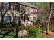 Beautiful two-story home with a well-manicured lawn, red door and attractive landscaping at 213 Huntington Dr, Chapel Hill, NC 27514