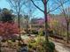 Exterior of a home featuring a landscaped front yard and colorful trees and bushes at 213 Huntington Dr, Chapel Hill, NC 27514