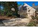 Attached two-car garage with a basketball hoop and adjacent parking area at 213 Huntington Dr, Chapel Hill, NC 27514