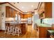 Spacious kitchen features wooden cabinets, granite countertops and an island with stool seating at 213 Huntington Dr, Chapel Hill, NC 27514