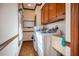 Convenient laundry room with washer, dryer, and ample storage cabinetry at 213 Huntington Dr, Chapel Hill, NC 27514