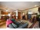Open living space with wood trim, flowing into the kitchen, with fireplace and comfortable seating at 213 Huntington Dr, Chapel Hill, NC 27514