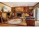 Inviting living room with brick fireplace, built-in bookshelves, and comfortable seating at 213 Huntington Dr, Chapel Hill, NC 27514