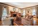 Inviting living room showcasing a fireplace, hardwood floors, and ample natural light at 213 Huntington Dr, Chapel Hill, NC 27514