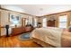 Spacious main bedroom featuring wood floors, natural light and a decorative rug at 213 Huntington Dr, Chapel Hill, NC 27514