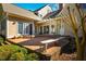 Inviting brick patio with a pergola is perfect for outdoor relaxation and entertaining with bench seating and multiple access points at 213 Huntington Dr, Chapel Hill, NC 27514