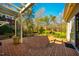 Brick patio with pergola offers stunning views of the lush backyard with mature trees and manicured landscaping at 213 Huntington Dr, Chapel Hill, NC 27514