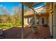 Covered brick patio with a pergola provides a tranquil outdoor space with views of the landscaped backyard and multiple entry doors at 213 Huntington Dr, Chapel Hill, NC 27514