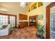 Sunroom with tile floors, white sofa, sink and lots of light at 213 Huntington Dr, Chapel Hill, NC 27514