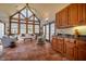 Bright sunroom features tile floors, light-colored sofas, and large windows for natural light at 213 Huntington Dr, Chapel Hill, NC 27514