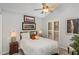 Comfortable bedroom offering natural light, neutral paint and a ceiling fan at 227 Windlestraw, Pittsboro, NC 27312