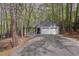 Charming home features a two-car garage and long driveway surrounded by trees at 227 Windlestraw, Pittsboro, NC 27312