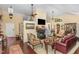Spacious living room with beautiful floors, fireplace, and plenty of natural light at 227 Windlestraw, Pittsboro, NC 27312