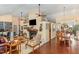Open-concept living space with a fireplace, cozy seating, and seamless flow to other living areas at 227 Windlestraw, Pittsboro, NC 27312