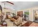 Well-lit living room featuring skylights, vaulted ceilings and a seamless flow to the rest of the home at 227 Windlestraw, Pittsboro, NC 27312