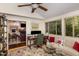 Bright living room with a ceiling fan, hardwood floors, and view to the formal living room at 227 Windlestraw, Pittsboro, NC 27312