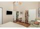 Bright main bedroom with hardwood floors, ceiling fan, and adjoining bathroom at 227 Windlestraw, Pittsboro, NC 27312