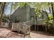 View of the back of home, featuring a deck and stairs to grade at 227 Windlestraw, Pittsboro, NC 27312