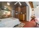 Bedroom featuring a bed, a brick accent wall, and plenty of natural light at 2281 Lamont Norwood, Pittsboro, NC 27312