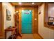 Cozy entryway with wooden trim, a bright blue door, and rustic decor for a warm welcome at 2281 Lamont Norwood, Pittsboro, NC 27312
