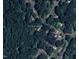 Aerial view of the property at 2419 George Anderson Dr surrounded by lush trees and green space at 2419 George Anderson Dr, Hillsborough, NC 27278