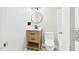 Updated bathroom featuring a wooden vanity, starburst pattern floor tiles, and modern fixtures at 2419 George Anderson Dr, Hillsborough, NC 27278