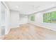 Bright bedroom with hardwood floors, neutral paint, large windows, and a ceiling fan at 2419 George Anderson Dr, Hillsborough, NC 27278